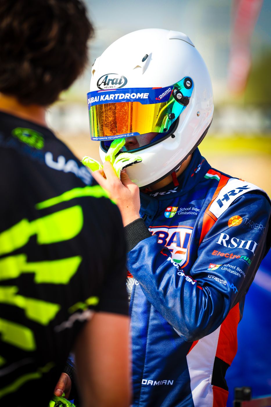 Damian Knorr putting on his helmet before the session